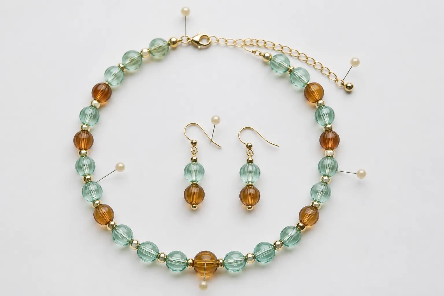 kendra scott earrings - Annotated product flat-lay showing a necklace-and-earring set in two-tone glass bead style, with callout labels indicating: stone grade, plating type, hook gauge, and matching finish between pendant and earring components — the kind of QC reference image an OEM buyer would use to brief a manufacturer