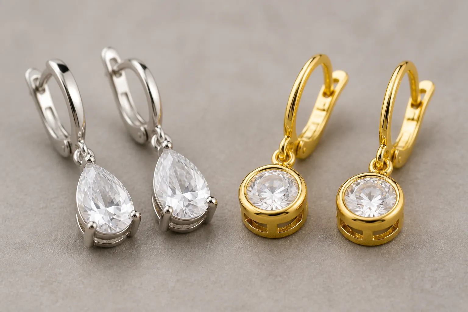 custom jewelry - Close-up editorial photo of two earring pairs side by side — a rhodium-plated OEM crystal drop earring and a standard retail gold-plated piece — with annotation labels pointing to plating finish, stone setting, and base hardware on each
